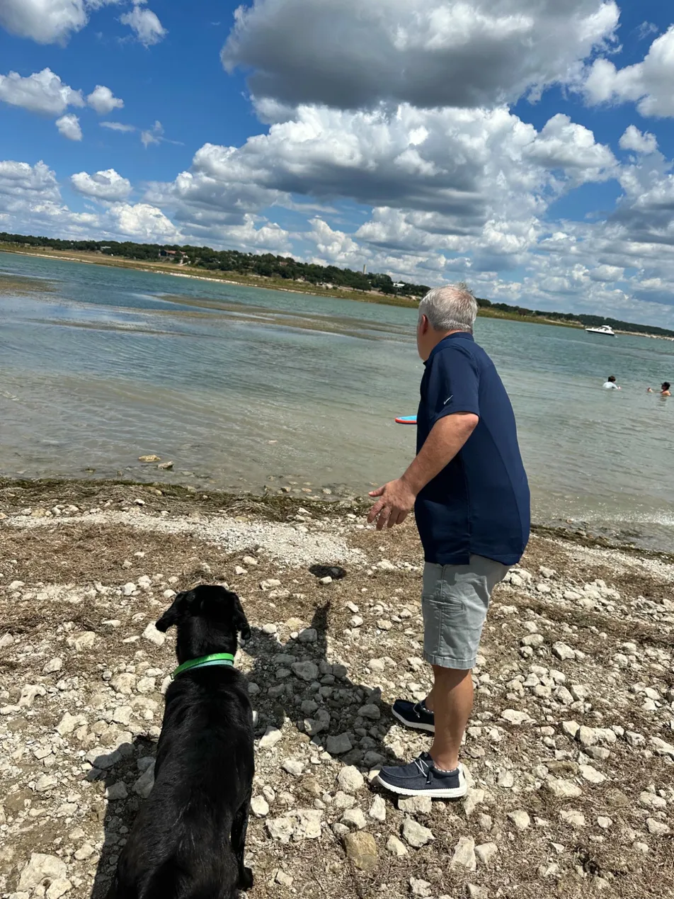 Critter Watch pet sitting client enjoying time with dog